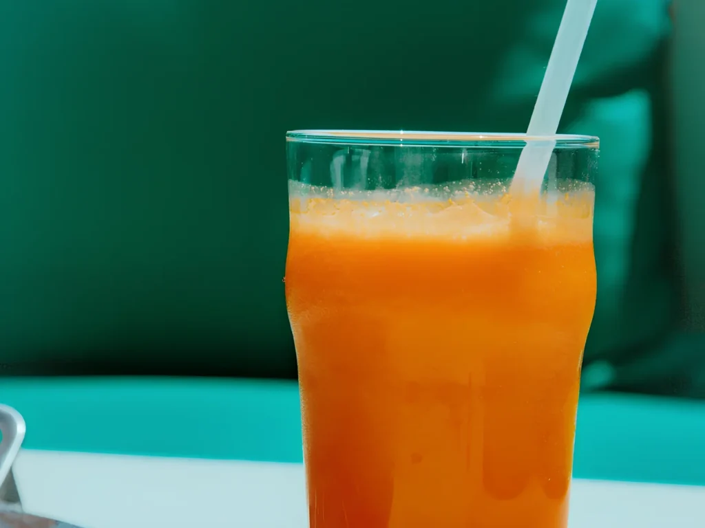 Image of Dunn Pea smoothie with anti-inflammatory mix, carrot, lime, apple.