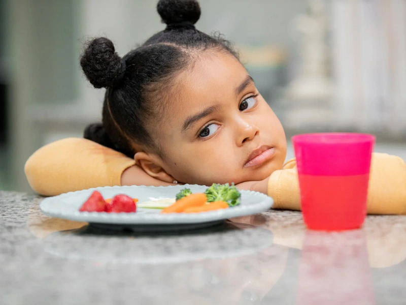 Image of a kid being a picky eater .