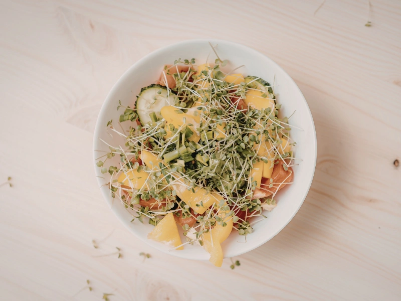 Image of colorful vegetables and microgreens for quick, nutritious cooking.