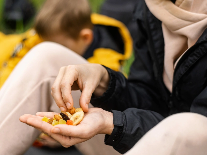 Image of young kids eating trail mix.
