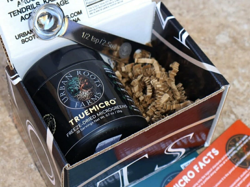 TrueMicro microgreens displayed with transparent ingredient labeling.