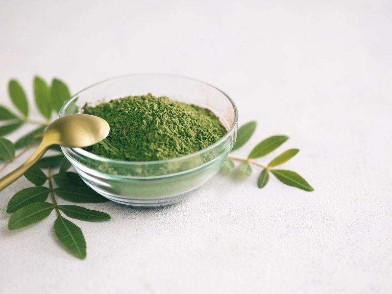 Image showing a fresh greens and powdered greens comparison.