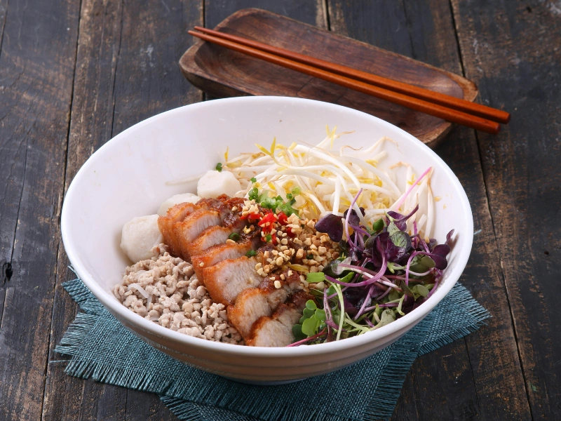 Image showing microgreens added to meal prep bowls.