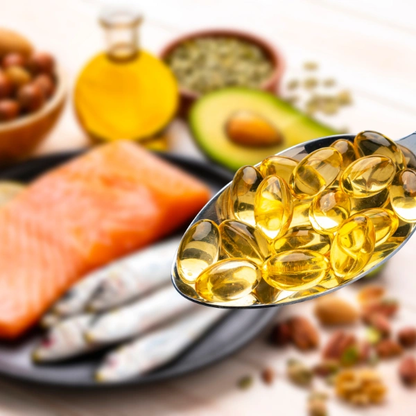 Image showing omega-3 capsules and healthy fatty foods.