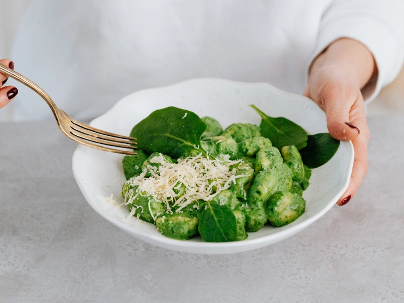 Image showing powdered greens added to a sauce.