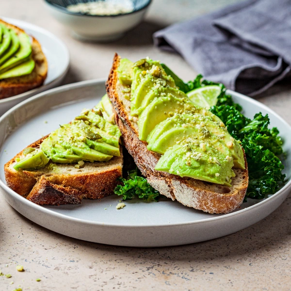 Image showing sliced avocado on whole-grain toast.
