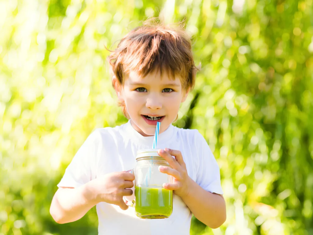 Image of a child enjoying a juice