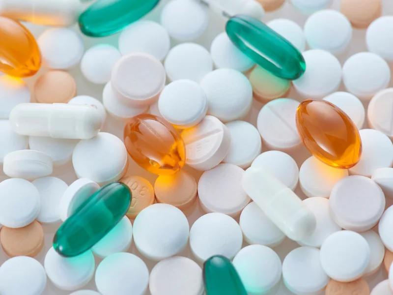 Image of assorted multivitamin tablets.